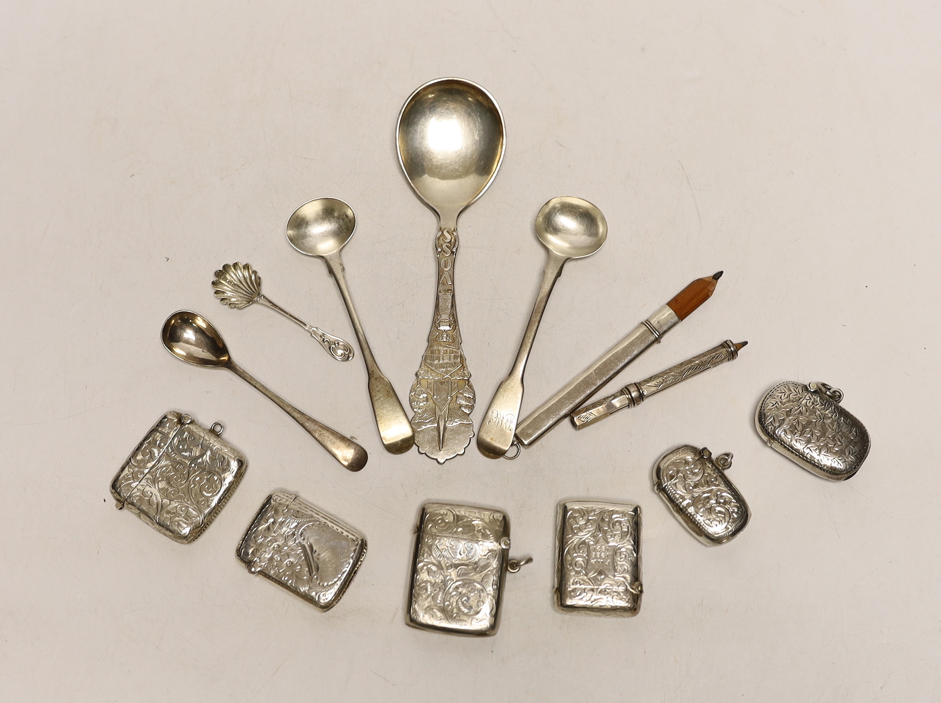 Six assorted early 20th century silver vesta cases, largest 45mm and a small quantity of sundry items including silver condiment spoons and two pencils.